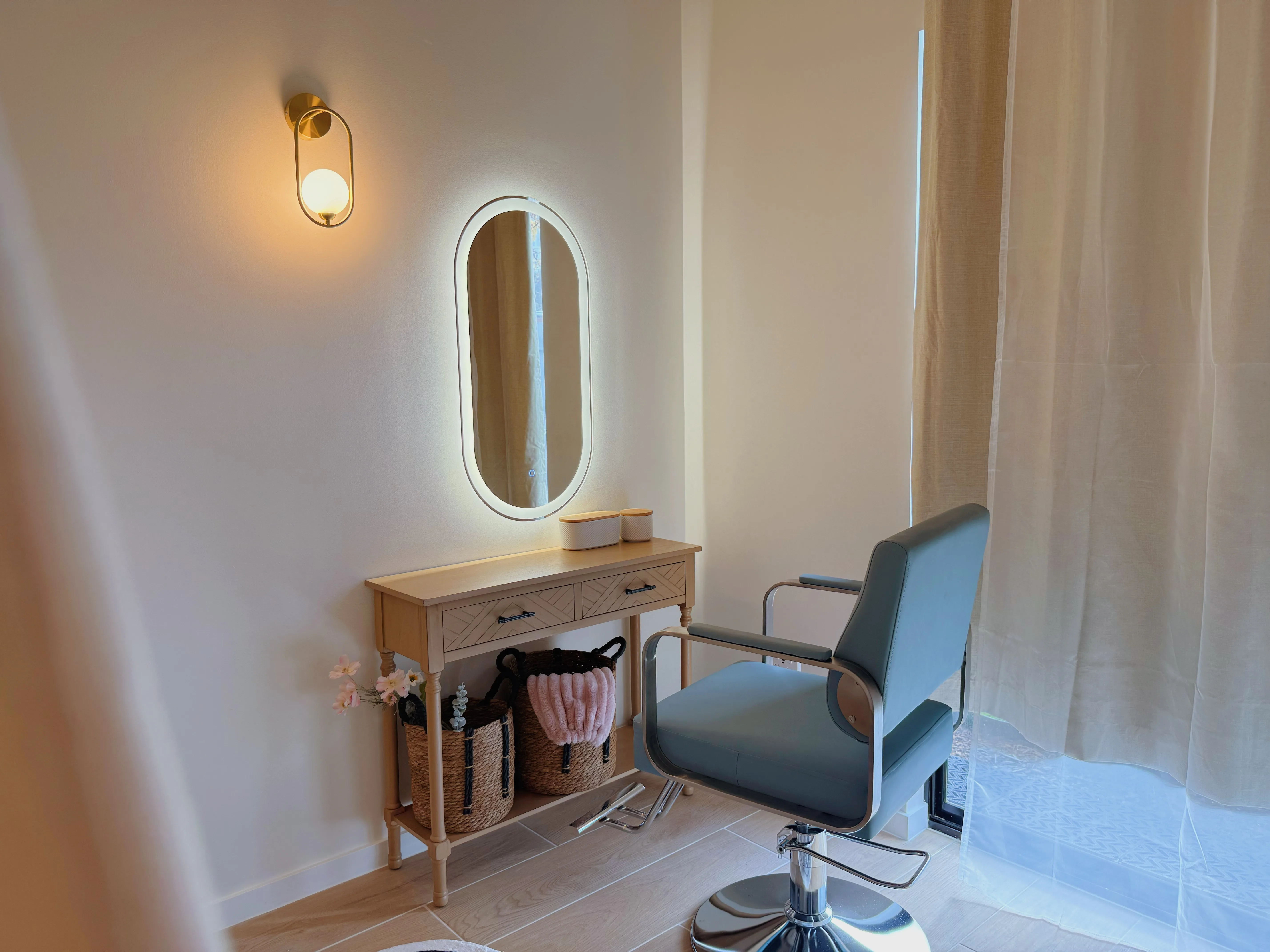 Styling station with oval LED mirror and oak console